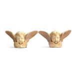 A pair of Italian carved Carrara marble cherub wall sculptures/sconces, 35cm wide, 17.5cm high