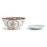 A 19th century Chinese export famille rose bowl, metal mounted rim, repairs, 20cm diameter; together