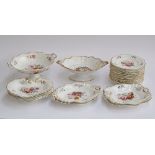 A 19th century part dinner service, 22 pieces, with hand painted floral spray decoration, heightened