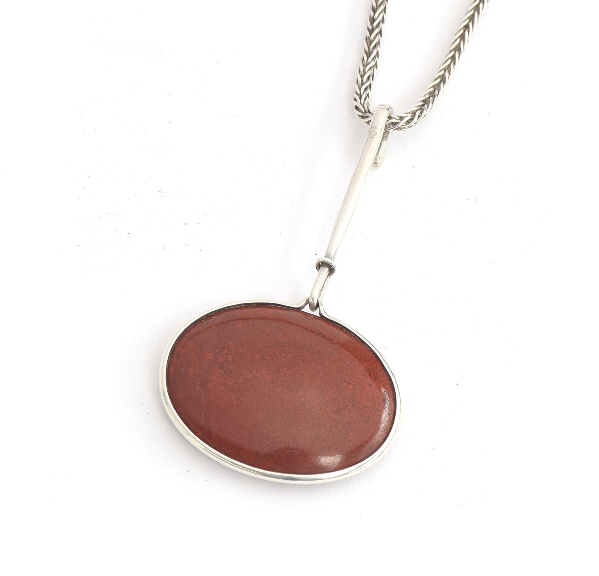 Vivianna Torun Bülow-Hübe for Georg Jensen, a scarce silver and polished red agate cabochon pendant,