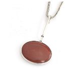 Vivianna Torun Bülow-Hübe for Georg Jensen, a scarce silver and polished red agate cabochon pendant,