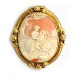 A large Victorian shell cameo brooch, depicting a continental country scene of a mother and son,