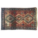 A West Persian rug, three serrated central lozenges, triple border, 265x172cm