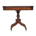 A William IV mahogany tea table, c.1830, foldover top on turned column, hipped and reeded supports