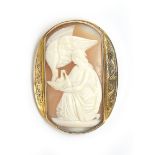 A Victorian shell cameo brooch depicting the Goddess Hebe and Zeus in the form of an eagle,