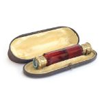 A 19th century Morden & Co. double ended scent and smelling salts bottle, faceted ruby glass, with