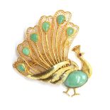 A 20th century Chinese 14ct gold peacock brooch, set with jade cabochons and a ruby eye, with safety