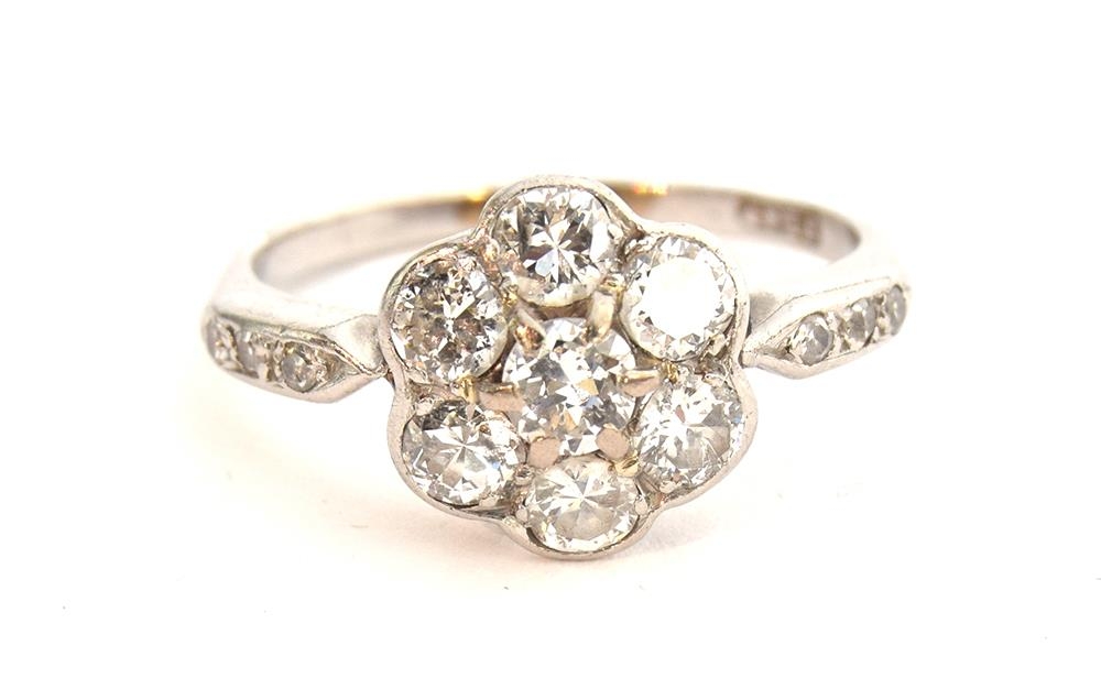 An Edwardian platinum and diamond floral cluster ring, six diamonds surrounding a central diamond, - Image 5 of 5