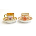 Two early 20th century KPM porcelain cups and saucers, one with floral spray design and gilt