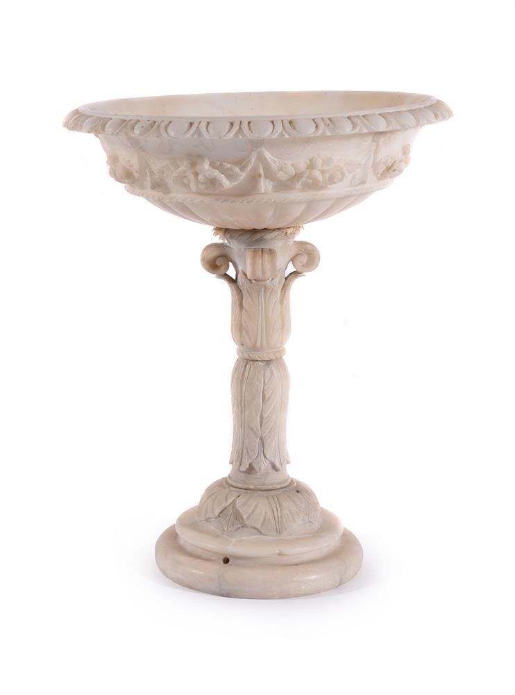 A carved alabaster tazza, 38cm high, the top 30cm diameter Provenance: Property of The Hon.