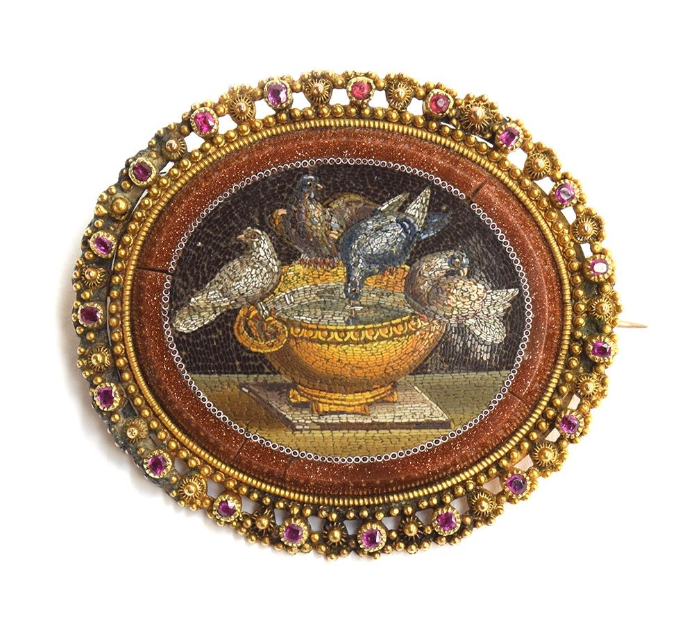A fine 19th century Italian micro mosaic brooch depicting Pliny's doves, in a yellow metal classical