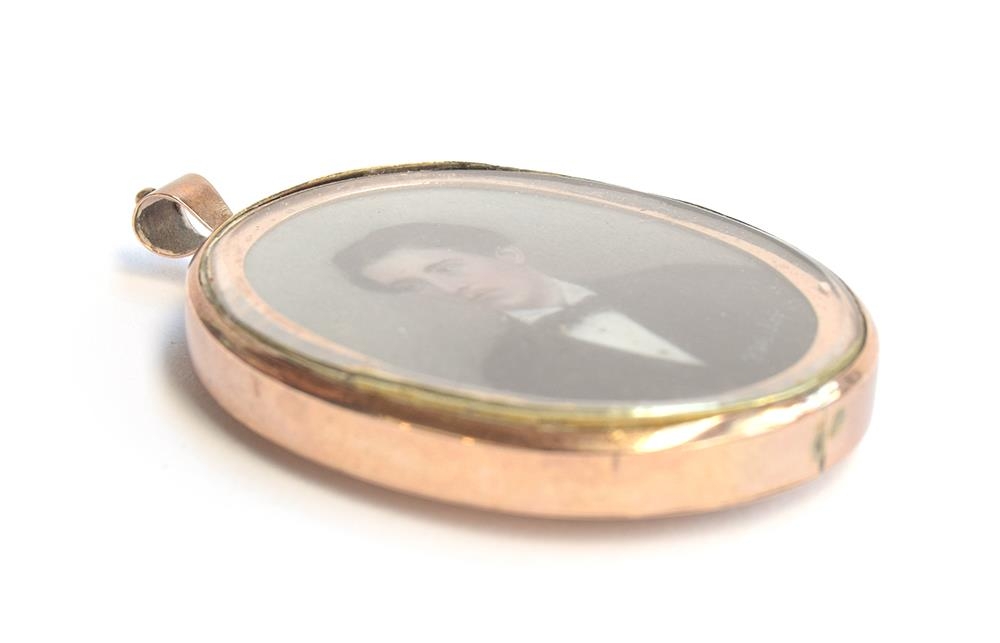 A 19th century gold locket containing a portrait miniature on ivory of a young man, signed 'K. - Image 3 of 3