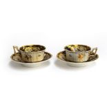 A pair of 19th century Grainger teacups and saucers c.1830, Royal Flute shape, panels of floral