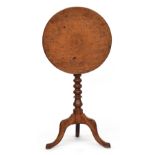 A small circular tripod table, tip-top on bobbin turned column on cabriole legs, 44cm diameter, 68cm