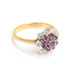 An 18ct gold, diamond and ruby floral cluster ring, size Q 1/2, approx. 4g