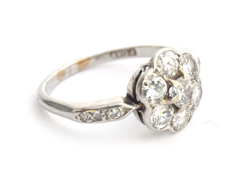 An Edwardian platinum and diamond floral cluster ring, six diamonds surrounding a central diamond, - Image 4 of 5