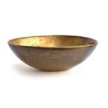 An extremely heavy studio brass bowl, stamped to base 2/6, 38cm wide