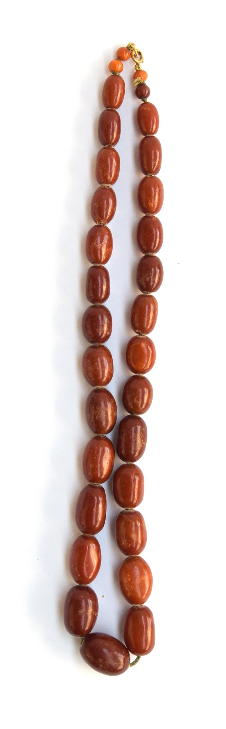 A graduated cognac amber bead necklace, approx. 59g, 57cm long