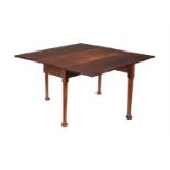 A George II mahogany drop leaf table, circa 1750, the drop leaf top above turned supports and pad