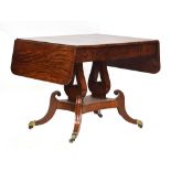 A Regency mahogany sofa table, drop leaf to each end, single drawer, raised on lyre supports and