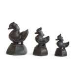 Three 19th century Burmese bronze opium weights in the form of hintha birds, the tallest 6.4cm high