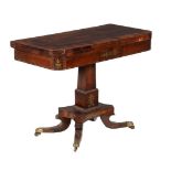 A George IV rosewood and brass inlaid card table, c.1825, the folding top enclosing a baize