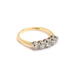 An 18ct gold and platinum five stone diamond ring, the largest central diamond approx. 0.15ct,