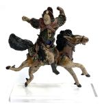 A Chinese polychrome glazed ceramic figural roof tile modelled as a warrior on horseback, 30cm high,