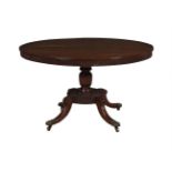 A George IV mahogany centre table, circa 1825, the circular top with reeded edge and frieze, 73cm