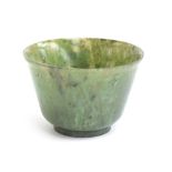 A Chinese spinach jade cup, of flaring form with short form foot, approx. 6cm diameter, 4cm high