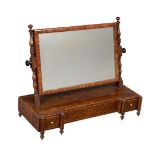 A George IV mahogany dressing mirror, circa 1825, of inverted breakfront outline, 61cm high, 77cm