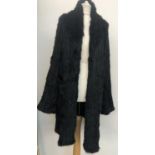 An Icone design black rabbit fur ladies coat, size 44 with shawl collar and side pockets