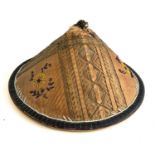 An oriental straw hat decorated with beaded flowers, 32cmD