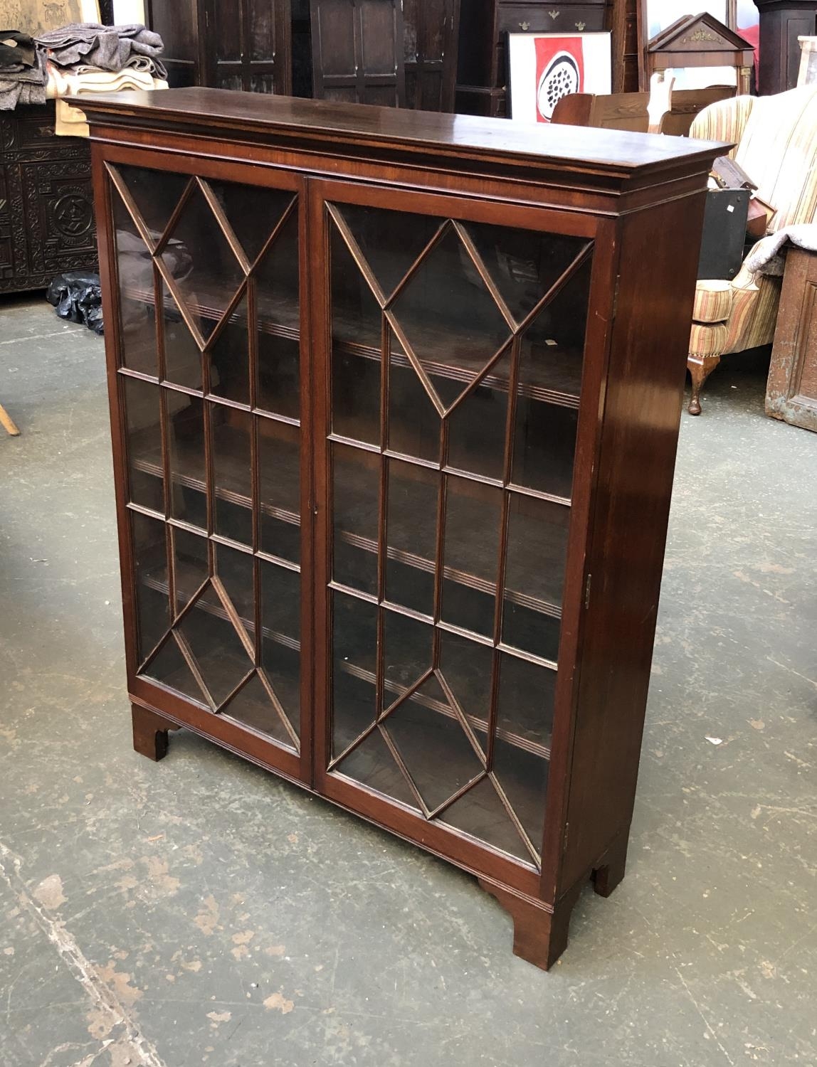 An astragal glazed bookcase with three adjustable shelves, 98x30x121cmH