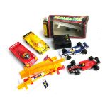 Four Scalextric cars to include Takefuji porsche, one other Porsche and two F1 cars, together with