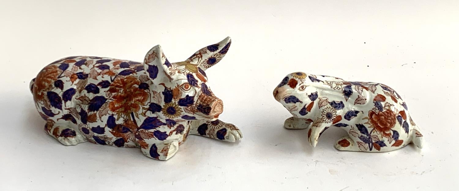 A large 20th century imari pattern porcelain pig (one leg af), 31cmL; together with a similar