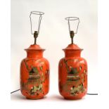 Interior design interest: a pair of terracotta orange painted Chinese style table lamps, depicting