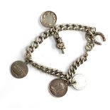 A silver charm bracelet (clasp af), to include Victorian silver penny engraved JVP, Winchester