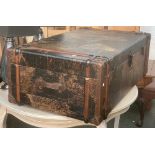 A coffee table in the form of a map clad travel trunk, 122x70x42cmH