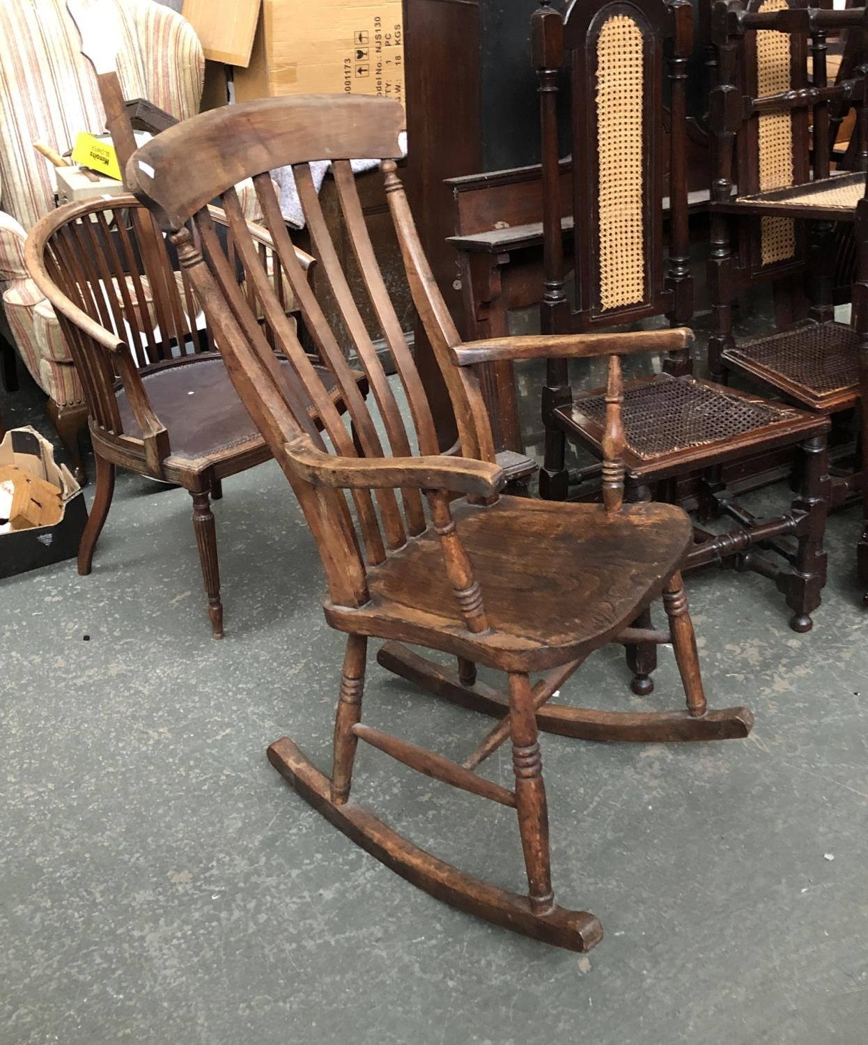 An ash and elm lathe back rocking chair