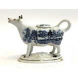 A 19th century Staffordshire Willow pattern cow creamer (repairs to base)