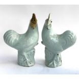 A pair of continental glazed cockerels, 30cmH