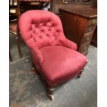 A Victorian button backed bedroom chair, with turned legs and ceramic casters