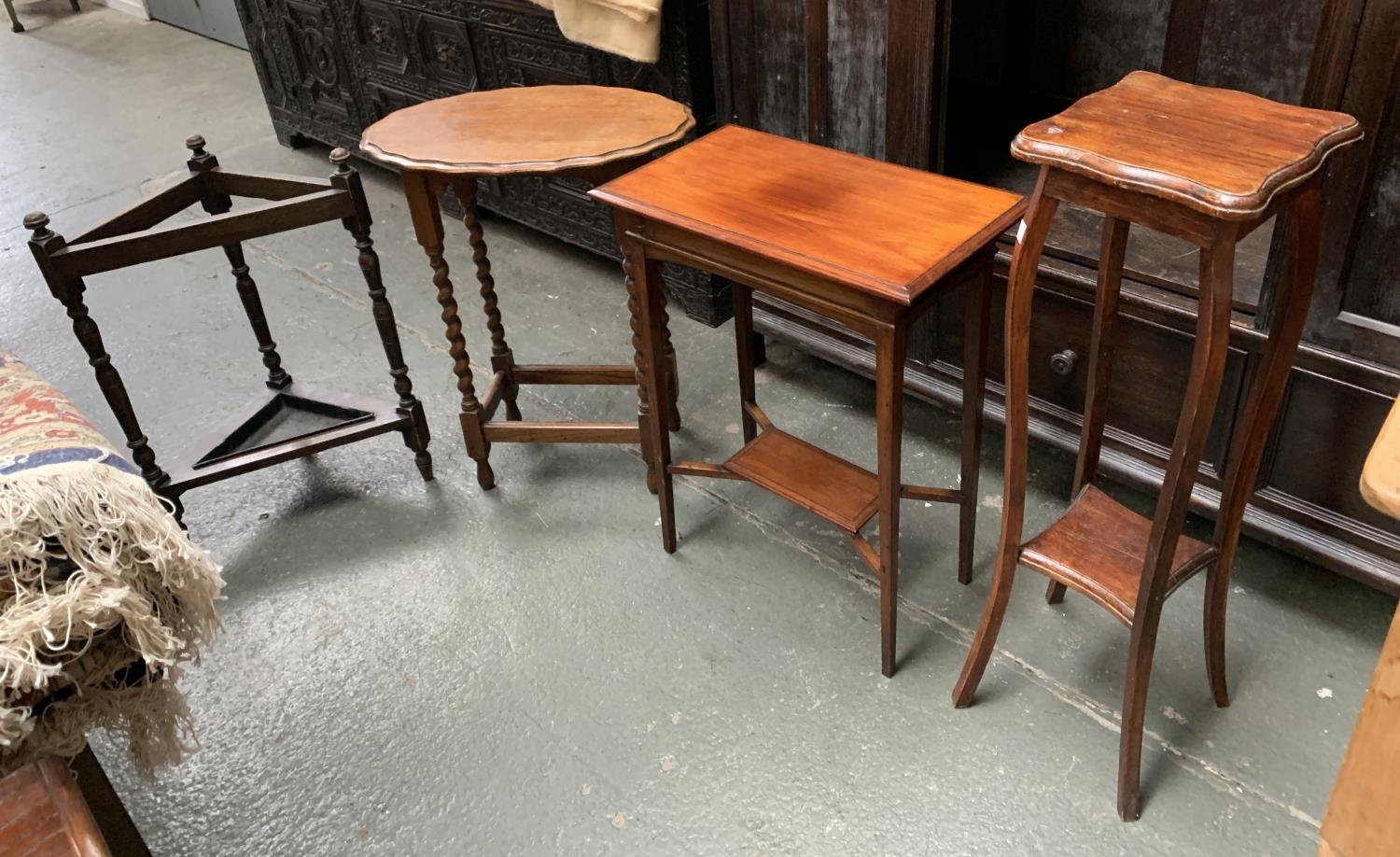 An oak corner stickstand with drip tray, 71cmH; together with an Edwardian occasional table with