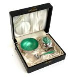 A Meka Danish sterling silver and green enamel cased salt and pepper, with spoon, the base of each