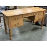 A pine kneehole desk, with five drawers, 151x55x81cmH