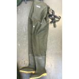 A pair of Ocean chest waders, size 11 with shoulder straps and Dunlop boots, the soles with studs