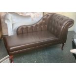 A modern brown vinyl upholstered chaise longue, 150cmL