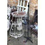 Two wrought metal plant stands, the taller 122cmH