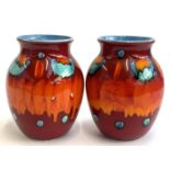 A pair of Poole Pottery Volcano vases, each 25cmH